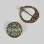 A white metal and green enamel targe shaped brooch by Alexander Ritchie of Iona, stamped marks A.