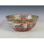 A Chinese famille rose Canton punch bowl, Qing Dynasty, decorated with panels of figures within