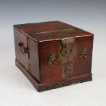 A Chinese dark wood and brass mounted travelling vanity box, late Qing Dynasty, the hinged