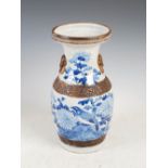 A Chinese porcelain blue and white crackle glazed vase, Qing Dynasty, decorated with chrysanthemum