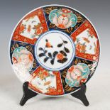 A Japanese Imari charger, late 19th/early 20th century, the circular panel decorated with peony