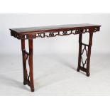 A Chinese dark wood tall altar table, Qing Dynasty, the rectangular panelled top above a pierced and