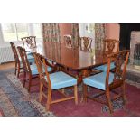 A George III style mahogany triple pedestal dining table and eight George III style mahogany