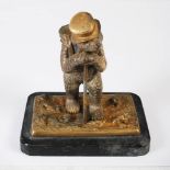 A late 19th century gilt bronze vesta holder in the form of a bear, modelled standing wearing a