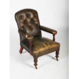 A Victorian mahogany green leather upholstered armchair, with button down upholstered back, arms and