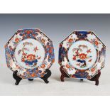 A pair of Chinese porcelain octagonal shaped plates, Qing Dynasty, the central roundels decorated