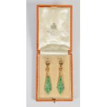 A pair of early 20th century yellow metal, pearl and jade earrings, in original fitted case for