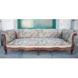 A 19th century rosewood sofa, the needlework upholstered back, arms and seat fronted by scroll and