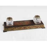 A late 19th/early 20th century boulle work desk stand, of rectangular form centred with a dished pen