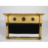 A 19th century Regency style gilt wood overmantel mirror, the frieze set with balls above three