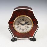 An Art Deco rosewood, tortoiseshell and ivory mantle clock, the silvered dial with Arabic and