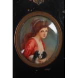 A 19th century portrait miniature of girl and dog, oval, painted on ivory, 6cm x 5cm, overall 12.5cm