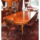 A Victorian mahogany dining room suite, comprising extending dining table, six button down leather