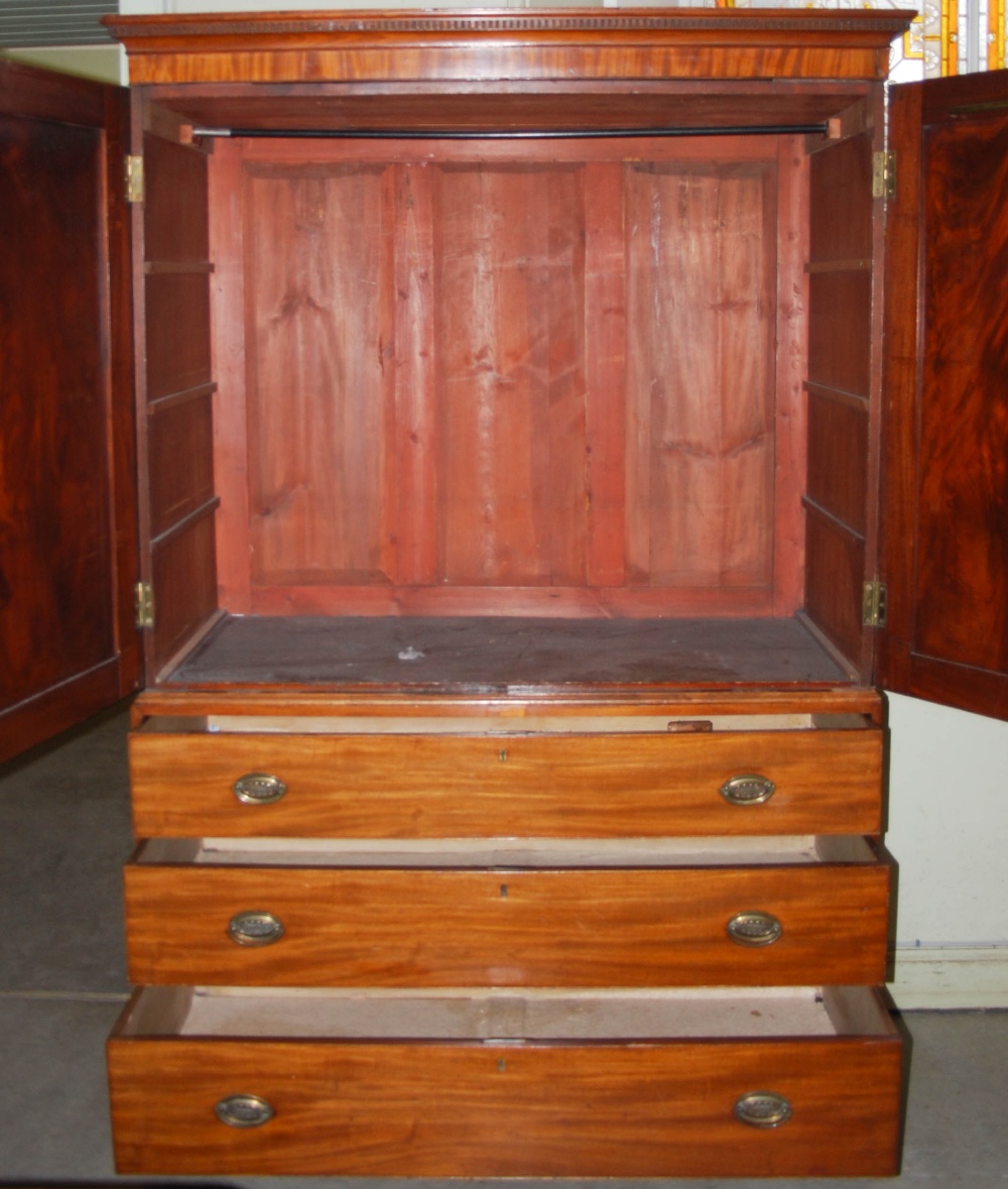 A 19th century mahogany linen press, the moulded cornice and dentil frieze above a pair of - Image 7 of 7