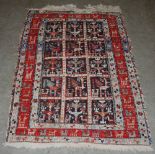 A Soumak flat weave rug, 20th century, the central rectangular field decorated with fifteen