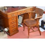 A Victorian oak pedestal desk by W. Finlay & Son, 81 Princes St., the rounded rectangular top with