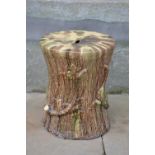 A Scottish pottery ochre, green and brown glazed garden seat in the form of a tree stump, with