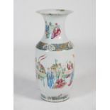 A large Chinese porcelain famille rose floor vase, Qing Dynasty, decorated with Court figures,