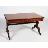 A 19th century Regency style brass inlaid centre table, the rectangular top inlaid with a brass line