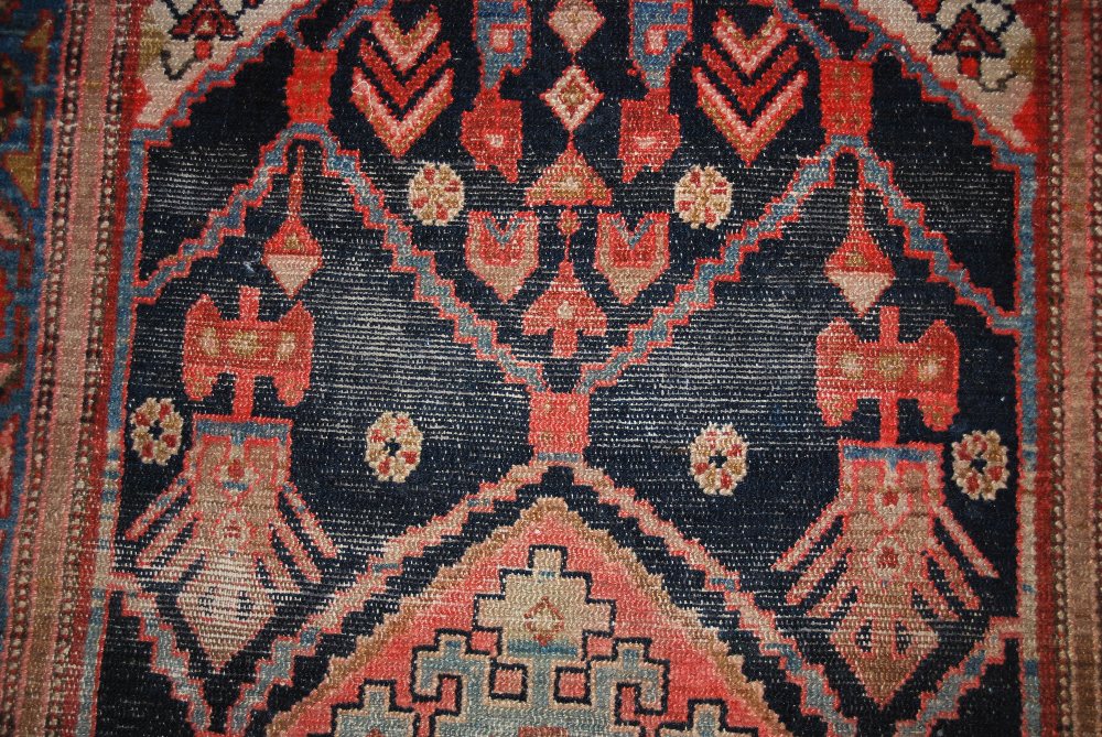A blue ground Eastern rug, 20th century, the rectangular field centred with a lozenge shaped - Image 3 of 4