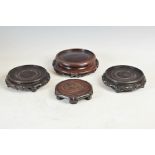 Four Chinese dark wood vase/ jar stands, Qing Dynasty, comprising; a pair of circular stands