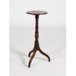 A 19th century mahogany occasional table, the circular top with a reeded edge, raised on a tapered