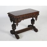 A late 19th century oak centre table, the rectangular top with canted angles above a long frieze