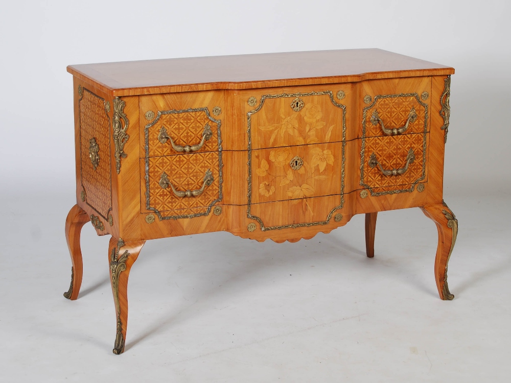 A French Louis XVI style marquetry and gilt metal mounted commode, the altered hinged top opening to