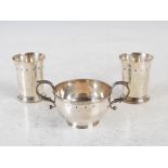A late 20th century silver loving cup and a pair of silver beakers, the loving cup Edinburgh,