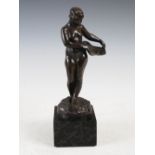 An early 20th century bronze figure of a nude, signed in the bronze 'Levy', raised on mottled