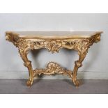 A 19th century Continental gilt wood Rococo style console table, the mottled yellow marble top