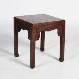 A Chinese dark wood square shaped table, Qing Dynasty, the square panelled top above a frieze carved