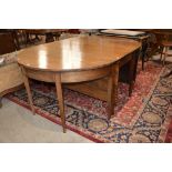 A 19th century mahogany D-end dining table, the centre section with two drop leaves flanked by two