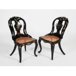 A pair of Victorian black lacquered papier mache side chairs, with gilded and mother of pearl inlaid