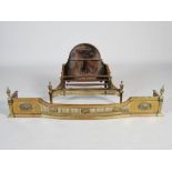 A late 19th/early 20th century cast iron and brass mounted fire basket in the Neo Classical style,