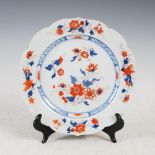 A Chinese porcelain Imari plate, of shaped circular form decorated with scattered foliate sprays