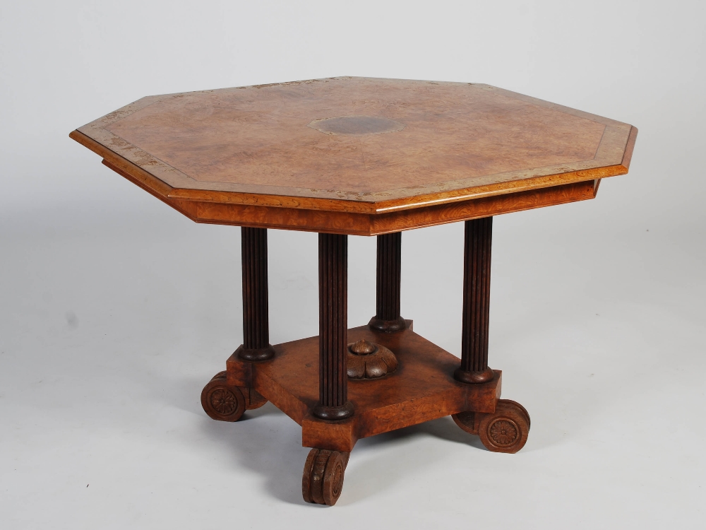 A 19th century pollard oak and ebony lined octagonal shaped centre table, the shaped top centred