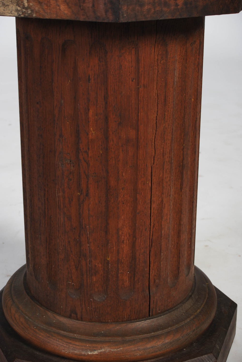 A 20th century oak octagonal plinth in the form of a fluted column, 36cm diameter x 58.5cm high. - Image 3 of 5