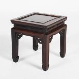 A Chinese dark wood square shaped stool, Qing Dynasty, the square panelled top raised on four square