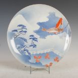 A Japanese porcelain charger, late 19th/early 20th century, decorated with carp and pine trees, 35.