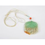 A Chinese jade, coral and seed pearl pendant, late 19th/ early 20th century, the jade pendant carved