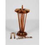 A Victorian pine croquet stick stand, containing eight numbered mallets, assorted hoops and balls,