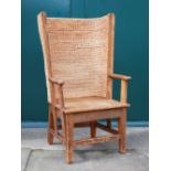 A late 19th/early 20th century stained pine Orkney chair, the woven back and solid planked seat