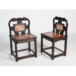 A pair of Chinese dark wood and mother of pearl inlaid side chairs, late Qing Dynasty, the shaped