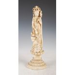 A Chinese ivory figure of Guanyin, late Qing Dynasty, modelled standing on a lotus throne, signed on