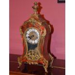 A late 19th/early 20th century boulle mantel clock, the circular dial with enamelled Roman numeral