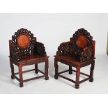 A pair of Chinese dark wood and burr wood armchairs, Qing Dynasty, the scroll carved backs set