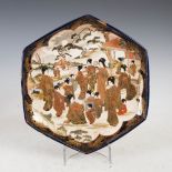 A Japanese Satsuma pottery blue ground hexagonal shaped dish, Meiji Period, decorated with bijin and