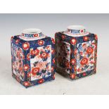 A pair of Japanese porcelain square shaped Imari jars, late 19th/early 20th century, decorated