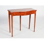 An Edwardian painted satinwood serpentine card table, the shaped rectangular top decorated with an